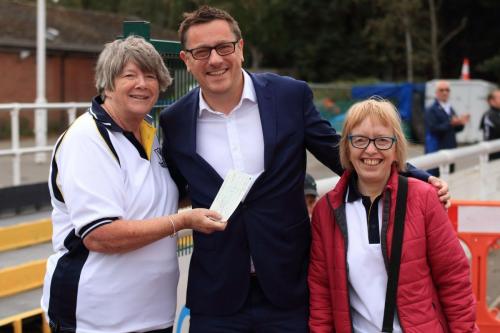 Chairman Paul Reed receives a cheque for ┬ú2000 from Sheila and Mary on behalf of the Supporters Club