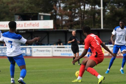 Enfields Charles Brown (L) passes to Muhammadu Faal who shoots wide
