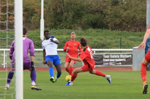 Enfields Junior Mubiayi cuts the ball back