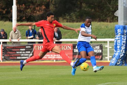 Enfields Ken Charles crosses as Edwin Mensah tries to block