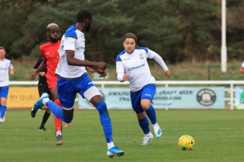 Enfields Lewis Taaffe (R) plays the ball to Muhammadu Faal