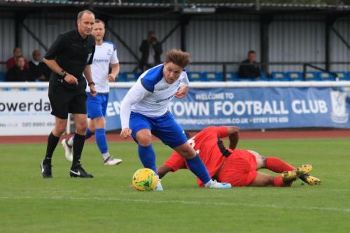 Enfields Lewis Taaffe and Mersthams Ellis Brown (red)