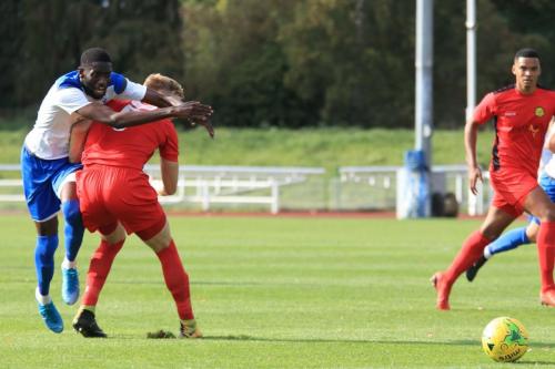 Enfields Muhammadu Faal (L) knocks the ball past James Richmondx