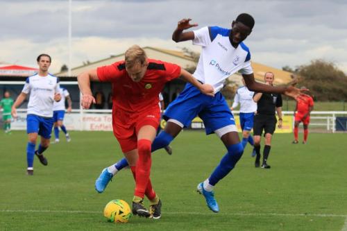 Enfields Muhammadu Faal (R) is penalised for a foul on James Richmond  Faal received a second yellow card for kicking the ball away