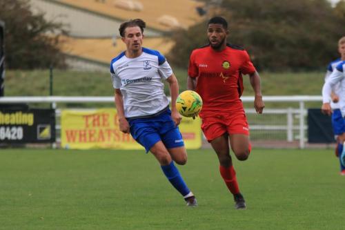 Enfields Sam Youngs (L) and Mersthams Ellis Brown