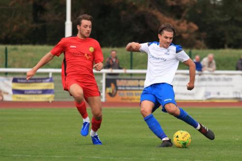 Mersthams Bradley Wilson (L) and Enfields Sam Youngs