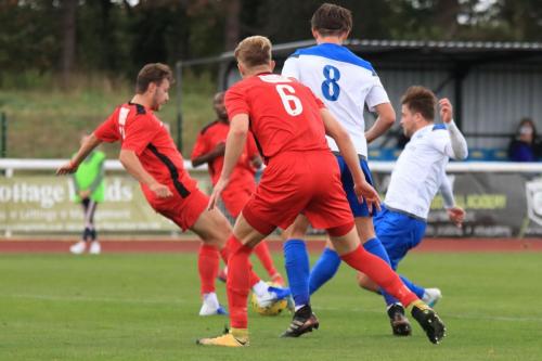 Mersthams Bradley Wilson (L) challenges Lewis Taaffe