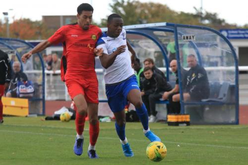 Mersthams Edwin Mensah (L) and Enfields Ken Charles