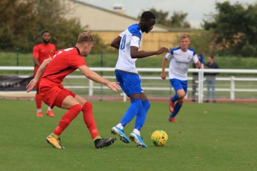 Mersthams James Richmond (L) and Enfields Muhammadu Faal