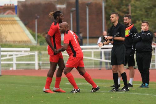 Mersthams assistant manager Barry Hayles, 47 years young, enters the game as substitute for Great Evans (L)