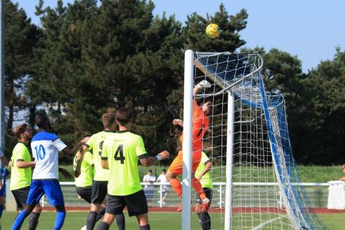 Potters Bar keeper Matt Nolan tips the ball over the bar