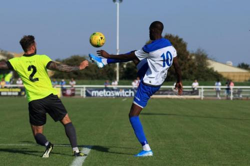 Potters Bars Chris Doyle (L) and Enfields Muhammadu Faal