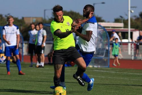 Potters Bars Chris Doyle (L) and Enfields Muhammadu Faalx