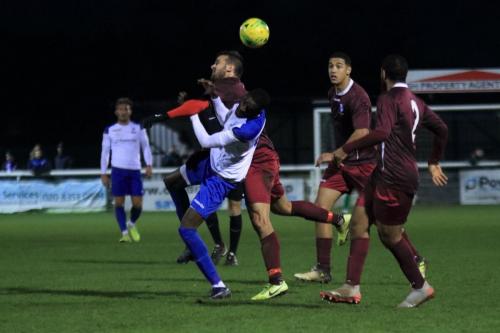 Wingates Ahmet Rifat (maroon, L) challenges Muhamamdu Faal watched by Christian Forino-Joseph and Luke Ifil (R)