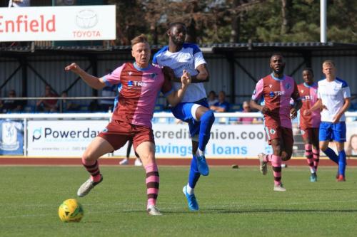 Casuals Jack Strange (L) and Enfields Muhammadu Faal