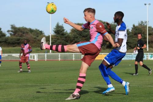 Casuals Jack Strange (L) clears from Muhammadu Faal