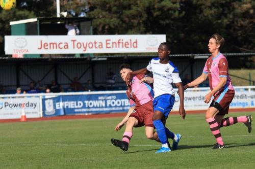 Casuals Jack Tucker (L) just gets ahead of Ken Charles to put the ball out for a corner