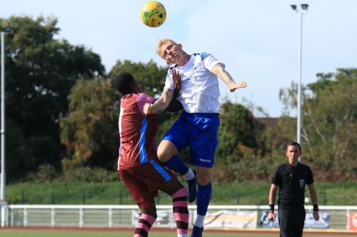 Casuals Mathia Bakare (L) and Enfields Ryan Blackman