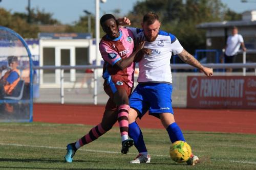 Casuals Mathias Bakare (L) and Enfields Billy Bricknell