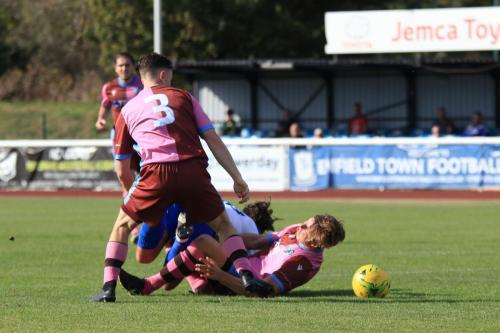 Casuals Robert Jamison (R) brings down Sam Youngs to concede a penalty