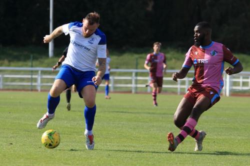 Enfields Billy Bricknell (L) and Casuals Juevan Spencer