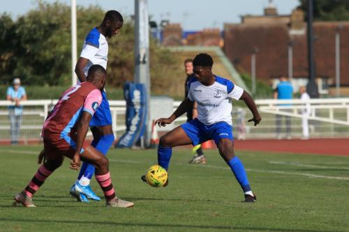 Enfields Charles Brown (R) and Muhammadu Faal and Casuals Juevan Spencer
