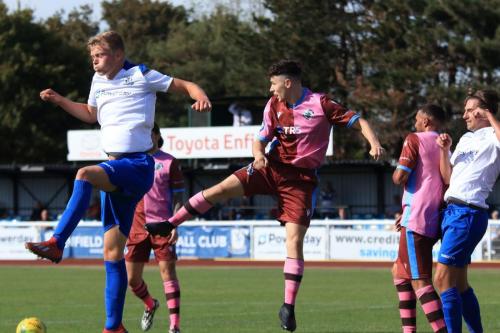 Enfields Joe Payne (L) and Sam Youngs and Casuals Jack Tucker and Mu Maan (2nd R)
