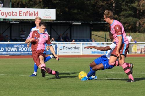 Enfields Ken Charles is pulled back by Robert Jamison (R)  The referee decided the foul was outside the box