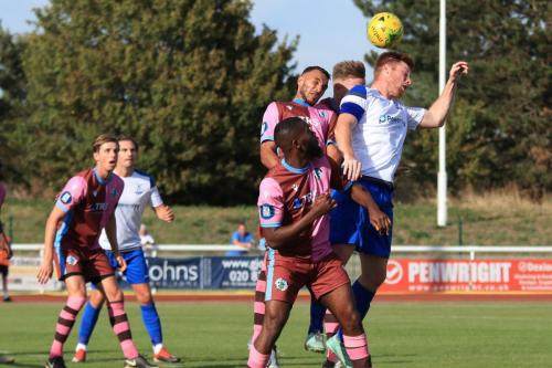 Enfields Marc Weatherstone (R) challenges at a set piece