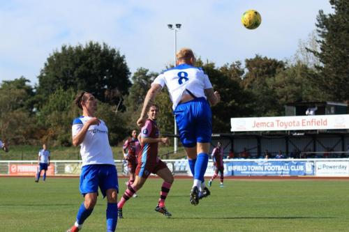 Enfields Ryan Blackman (8) heads across goal to set up the second goal
