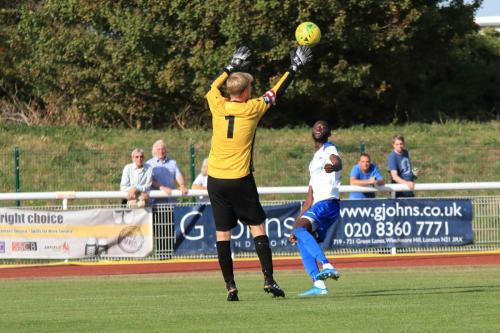 Muhammadu Faal lobs Danny Bracken for his second goal and Enfields thirdx