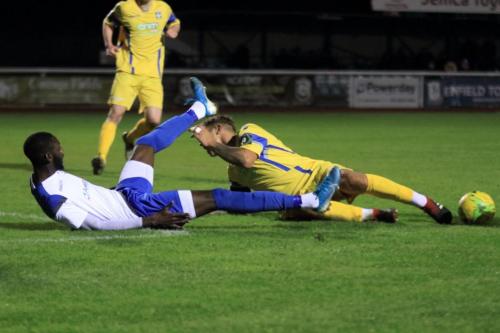 Enfields Muhammadu Faal (L) and Stortfords Ryan Henshaw