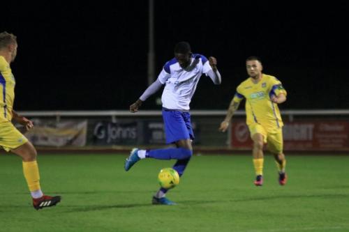 Enfields Muhammadu Faal and Stortfords Ryan Henshaw (L) and Ben Sampayo