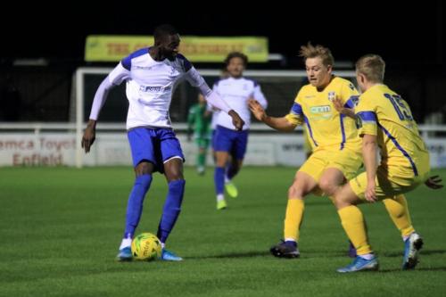 Enfields Muhammadu Faal and Strotfords Alex Warman and Alfie Mason (R)