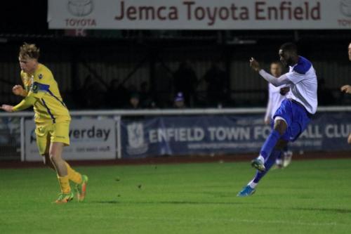 Enfields Muhammadu Faal shoots as Aaron Greene tries to block