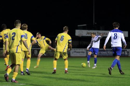 Enfields Sam Hatton fires the ball into a crowded penalty area