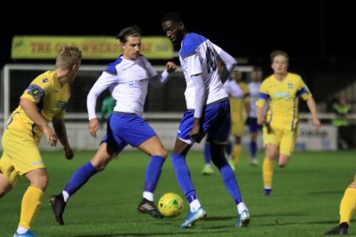 Enfields Sam Youngs and Muhammadu Faal (R) and Stortfords Alfie Mason
