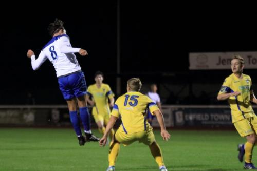 Enfields Sam Youngs heads on goal