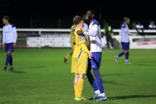 Former team mates Aaron Greene (L, of Stortford) and Muhammadu Faal embrace at the final whistle