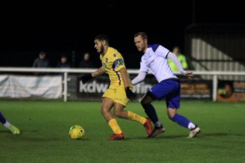 Stortfords Jordan Chiedozie (L) and Enfields Sam Hatton