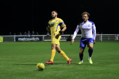 Stortfords Jordan Chiedozie (L) and Enfields Scott Thomas