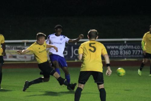 Broadfields Ryan Phillips (L) tackles Nnamdi Egboh