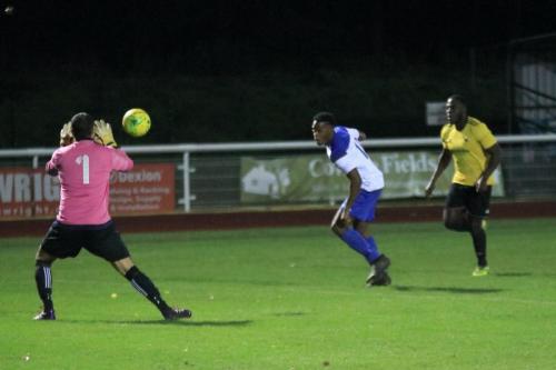 Broadfields keeper Kieran Jimmy saves from Nnamdi Egboh