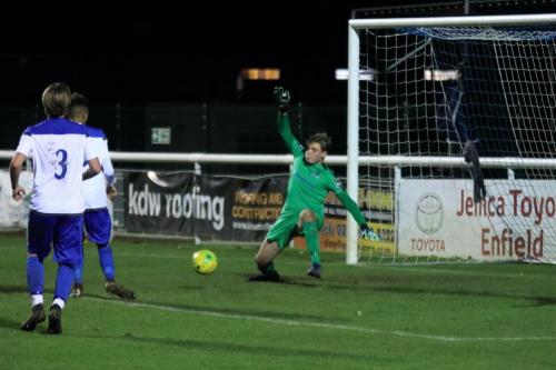 Enfield keeper Teddy Reynolds is beaten for the first Broadfields goal to make it 1-1