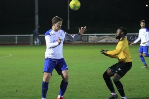 Enfields Glenn Wilson (L) heads clear from Jamel Mattan