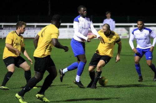 Enfields Junior Mubiayi (white, L) challenged by Harry Henley, watched by (L-R) Ryan Phillips, Rex Kimona and James Mulley
