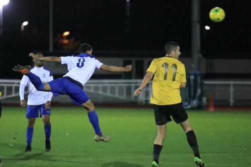 Enfields Kyle Lynch (8) heads clear