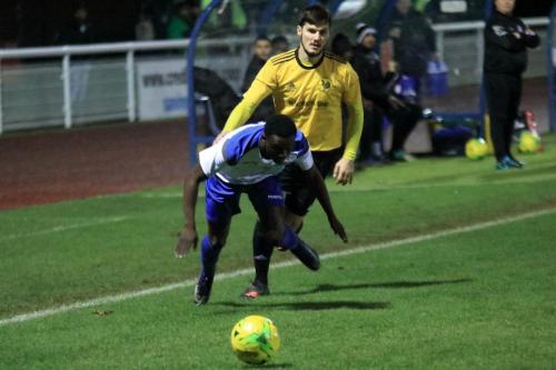 Enfields Mo Koita (L) is brought down by Dene Gardner