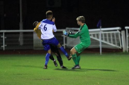 Enfields keeper Teddy Reynolds and Dante McIntosh (6) combine to deny Jamel Matten