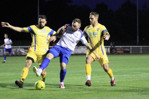 Enfields Billy Bricknell and Stortfords Sam Robbins (L) and Ryan Henshaw
